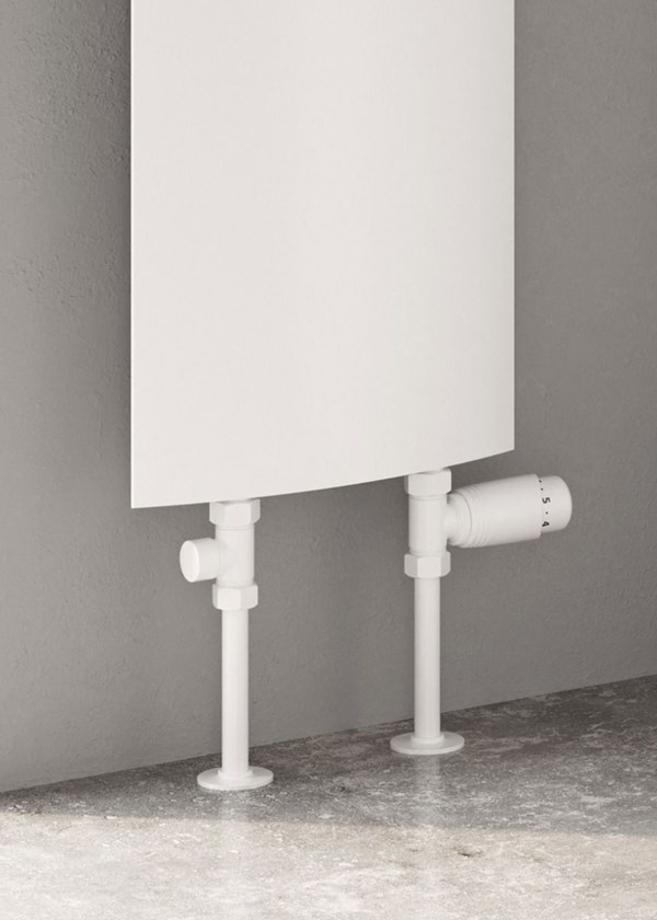 Reina Picoli Finished in White - Close-Up - Shown with Reina Modal Thermostatic Radiator Valves, Straight, White finish and White Pipe Sleeves and Shrouds Reina Picoli Finished in White - Close-Up - Shown with Reina Modal Thermostatic Radiator Valves, Straight, White finish and White Pipe Sleeves and Shrouds