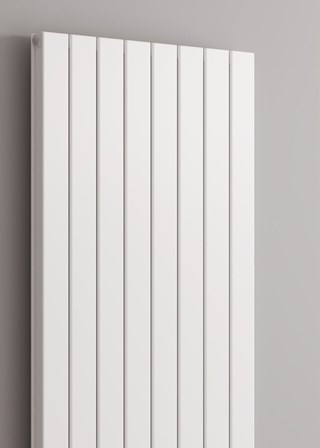 Reina Piatto finished in White - Close-Up - Shown with Reina Modal Thermostatic Radiator Valves, angled, White finish and White Pipe Sleeves and Shrouds Reina Piatto finished in White - Close-Up - Shown with Reina Modal Thermostatic Radiator Valves, angled, White finish and White Pipe Sleeves and Shrouds